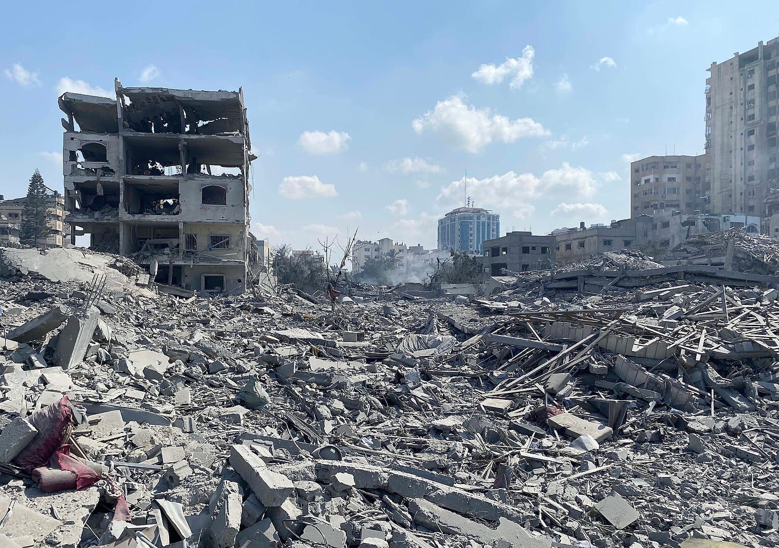 Image of rubble and bombed buildings following an air strike in Gaza City.