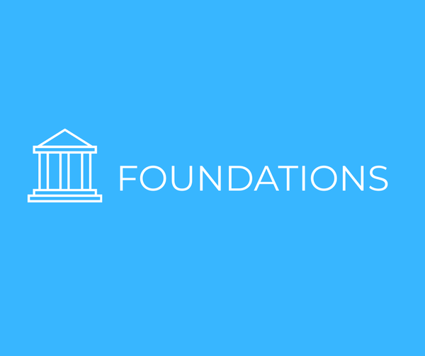 A white icon of a building next to the word "Foundations," on a light blue background.